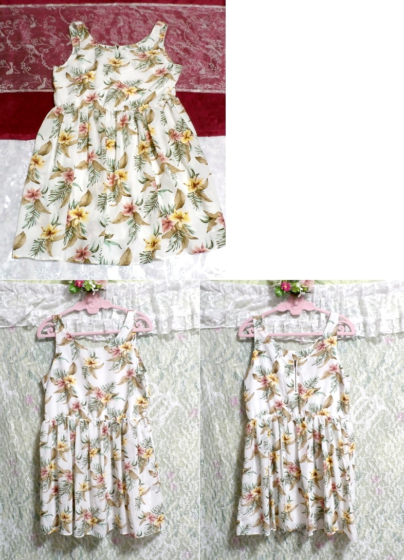 Feuilles motif floral blanc mini-robe sans manches blanche, jupe jusqu'aux genoux, taille L
